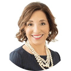 Professional headshot of a smiling woman with a pearl necklace.